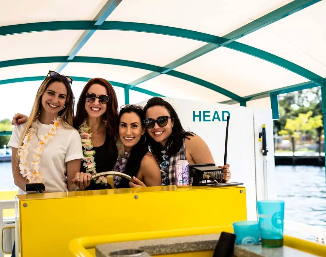Four guests wearing leis at the pedal stations